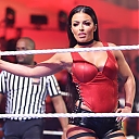 WWE-Female-wrestler-Mandy-Rose-wearing-a-red-spandex-costume~0.jpeg